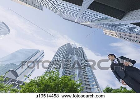 A businessman in business district View Large Photo Image Stock Photo - A businessman in business district. Fotosearch