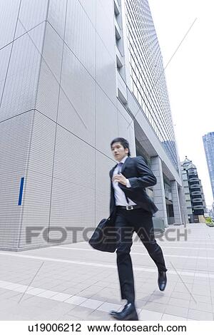A running businessman View Large Photo Image Stock Image - A running businessman. Fotosearch
