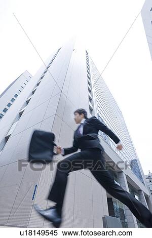 Stock Photography - A running businessman. Fotosearch