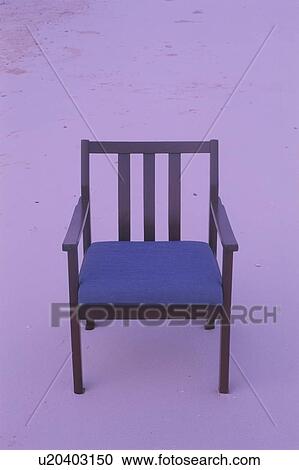 Stock Image - An Armchair on Beach. Fotosearch