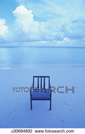 Stock Image - An Armchair on Beach. Fotosearch