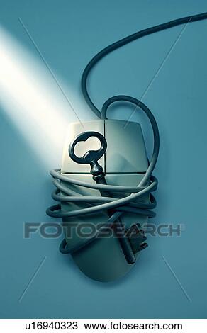 Stock Image - Antique key on computer mouse. Fotosearch