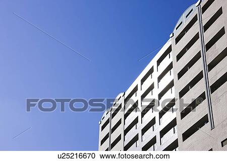 Stock Image - Apartment building under sky, copy space, Nishinomiya city, Hyogo prefecture, Japan. Fotosearch