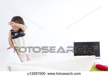 Baby girl covering eyes View Large Photo Image Stock Image - Baby girl covering eyes. Fotosearch