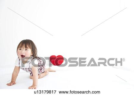 Baby girl crawling View Large Photo Image Stock Photo - Baby girl crawling. Fotosearch