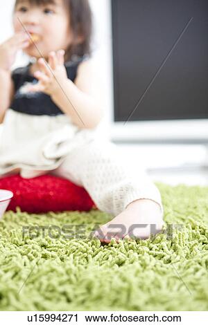 Baby girl eating cookie View Large Photo Image Stock Image - Baby girl eating cookie. Fotosearch