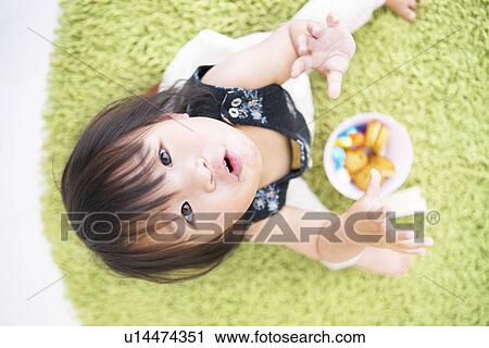 Baby girl looking up View Large Photo Image Stock Image - Baby girl looking up. Fotosearch
