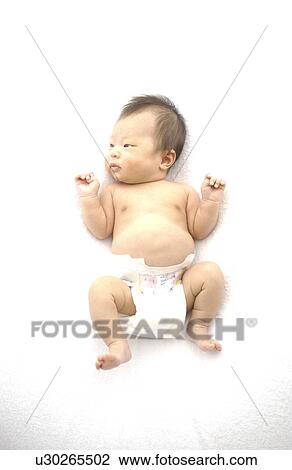 Stock Image - Baby in diaper on white background. Fotosearch
