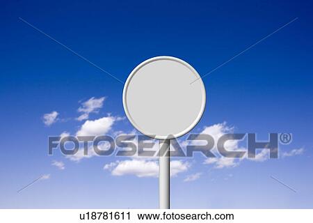 Stock Image - Blank road sign against sky, computer graphic. Fotosearch