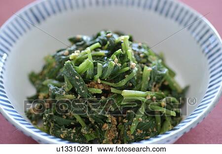 Stock Image - Boiled spinach with sesame. Fotosearch