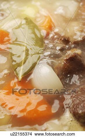 Boiled vegetables with bay leaf, close up, full frame View Large Photo Image Picture - Boiled vegetables with bay leaf, close up, full frame. Fotosearch