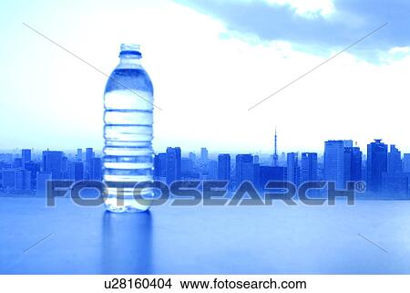 Picture - Bottle of water, cityscape in background, toned image, Tokyo prefecture, Japan. Fotosearch