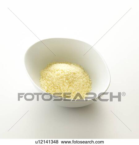 Stock Photo - Bowl of grated cheese, white background. Fotosearch