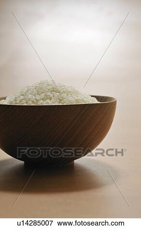 Bowl of raw rice View Large Photo Image Stock Photo - Bowl of raw rice. Fotosearch