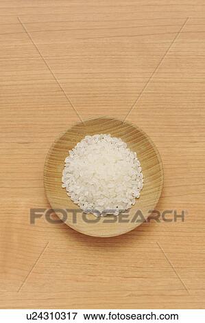 Stock Photo - Bowl of raw rice. Fotosearch