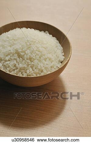 Bowl of raw rice View Large Photo Image Stock Photograph - Bowl of raw rice. Fotosearch