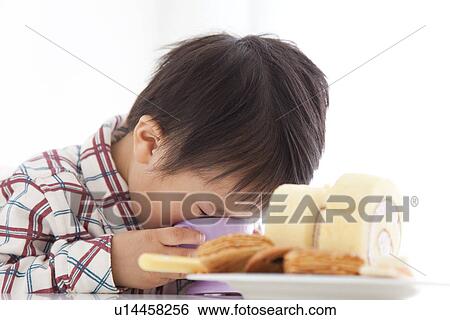Boy drinking juice from a plastic cup View Large Photo Image Stock Photograph - Boy drinking juice from a plastic cup. Fotosearch