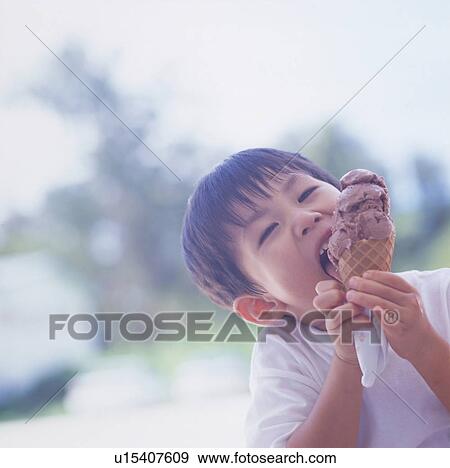 Boy eating ice cream View Large Photo Image Stock Photo - Boy eating ice cream. Fotosearch
