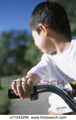 Boy riding bike View Large Photo Image Stock Photography - Boy riding bike. Fotosearch
