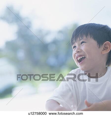 Boy smiling outdoors View Large Photo Image Stock Image - Boy smiling outdoors. Fotosearch