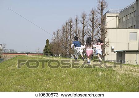 Boys and girls running on riverbank View Large Photo Image Stock Image - Boys and girls running on riverbank. Fotosearch
