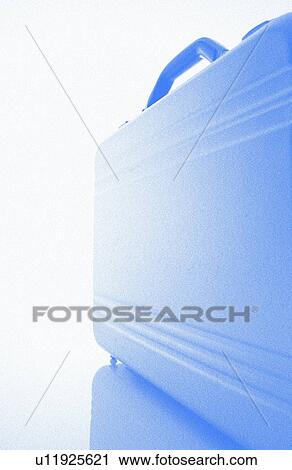 Stock Image - Briefcase, close up, blue background, soft focus. Fotosearch