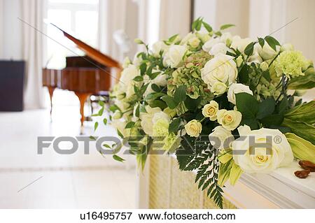 Bunch of white roses, grand piano in background View Large Photo Image Stock Photo - Bunch of white roses, grand piano in background. Fotosearch