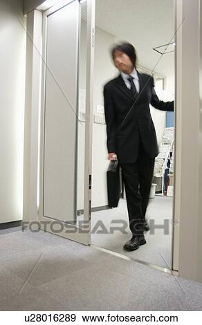 Business Man Coming Out of Office View Large Photo Image Stock Photo - Business Man Coming Out of Office. Fotosearch