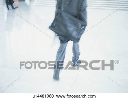 Stock Image - Businessman running. Fotosearch