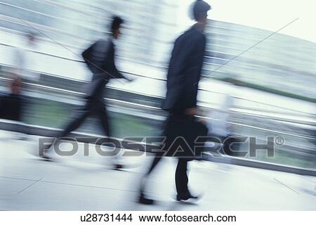 Picture - Businessmen walking. Fotosearch