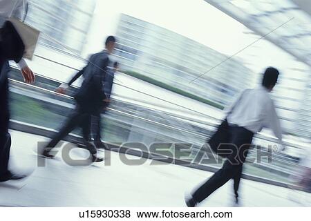 Businessmen walking View Large Photo Image Stock Photo - Businessmen walking. Fotosearch