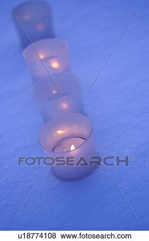 Stock Photo - Candles on snow. Fotosearch