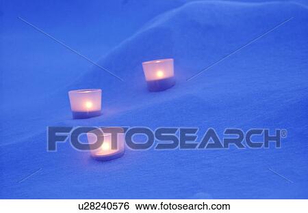 Candles on snow View Large Photo Image Stock Photograph - Candles on snow. Fotosearch