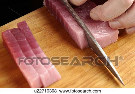 Chef cutting tuna, close up View Large Photo Image Stock Photo - Chef cutting tuna, close up. Fotosearch