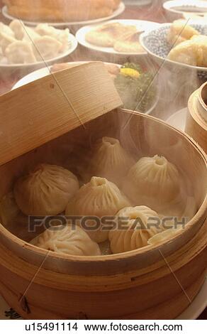 Chinese dumplings in steamer View Large Photo Image Picture - Chinese dumplings in steamer. Fotosearch