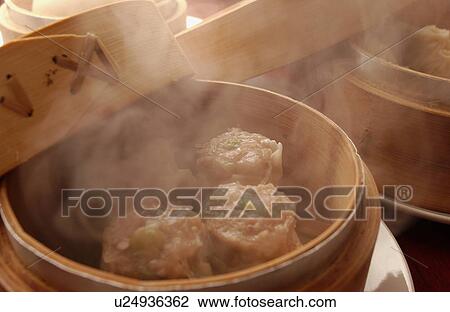 Stock Image - Chinese dumplings in steamers. Fotosearch