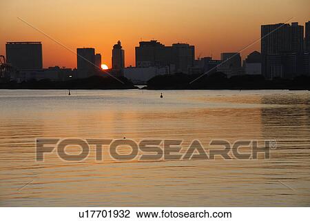 Stock Image - Cityscape at sunset, Minato Ward, Tokyo Prefecture, Honshu, Japan. Fotosearch