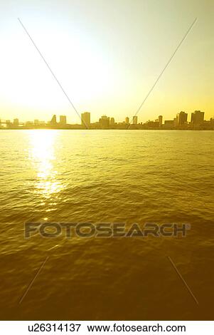 Stock Photo - Cityscape beyond Tokyo bay, sepia toned, copy space, Tokyo prefecture, Japan. Fotosearch