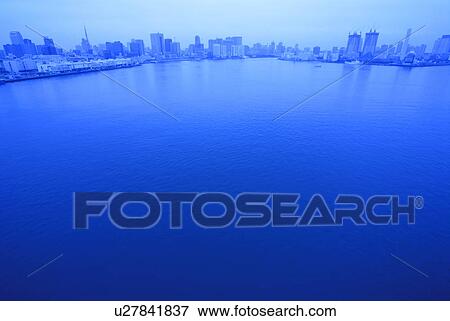 Cityscape beyond Tokyo bay, toned image, copy space, Tokyo prefecture, Japan View Large Photo Image Stock Photo - Cityscape beyond Tokyo bay, toned image, copy space, Tokyo prefecture, Japan. Fotosearch