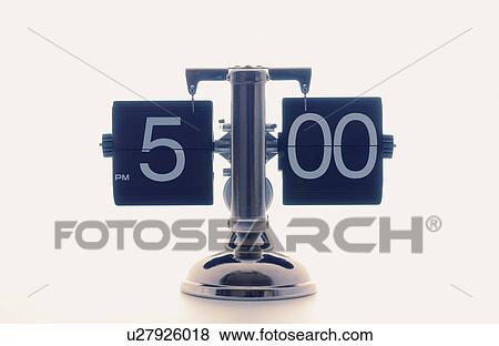 Stock Photo - Clock showing 5 o'clock, white background. Fotosearch