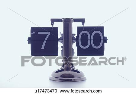 Clock showing 7 o'clock, white background View Large Photo Image Stock Image - Clock showing 7 o'clock, white background. Fotosearch