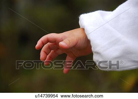 Picture - Close up of baby boy's hand, differential focus. Fotosearch