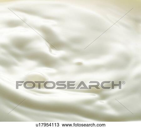 Stock Image - Close up of milk, full frame. Fotosearch