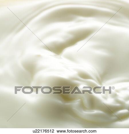 Stock Image - Close up of milk, full frame. Fotosearch