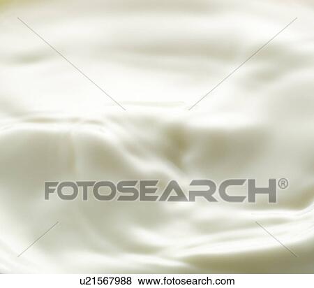 Stock Photo - Close up of milk, full frame. Fotosearch
