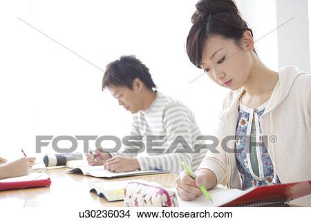 Picture - College students studying. Fotosearch