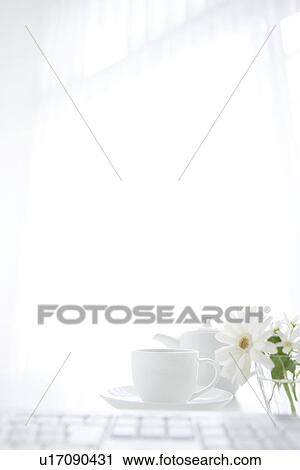 Computer keyboard and cup of coffee on desk in office View Large Photo Image Stock Image - Computer keyboard and cup of coffee on desk in office. Fotosearch