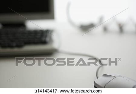 Computer mouse on desk, close up, white background, differential focus View Large Photo Image Stock Photo - Computer mouse on desk, close up, white background, differential focus. Fotosearch
