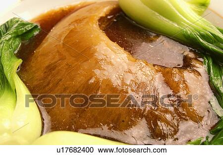 Stock Image - Cooked shark's fin, close up. Fotosearch