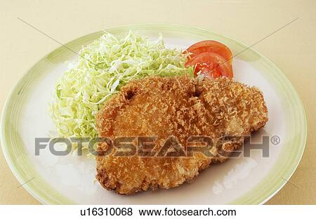 Stock Photo - Deep fried pork on plate, white background. Fotosearch